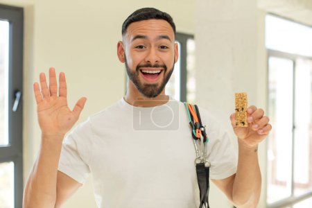 Photo for Arab handsome man arab man feeling happy and astonished at something unbelievable.  fitness and cereal bar concept - Royalty Free Image