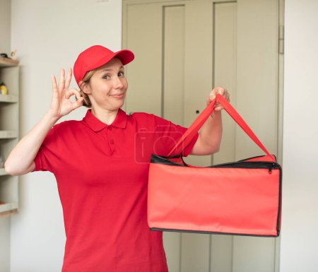 Photo for Feeling happy, showing approval with okay gesture. pizza delivery concept - Royalty Free Image