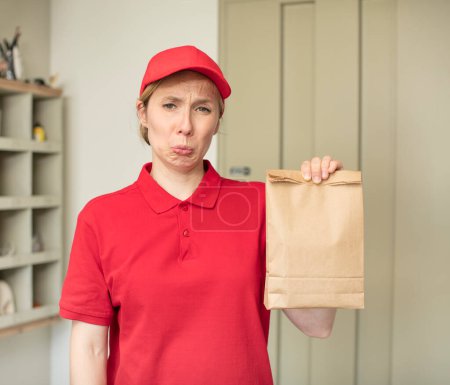 Photo for Feeling sad and whiney with an unhappy look and crying. delivery and take away concept - Royalty Free Image