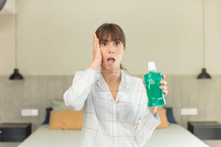 Photo for Young pretty woman feeling extremely shocked and surprised. mouthwash concept - Royalty Free Image