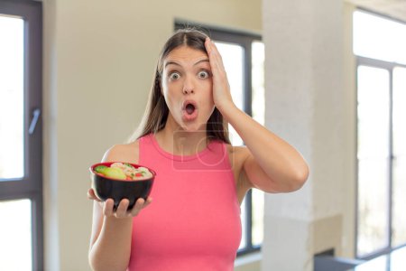 Photo for Young pretty woman feeling extremely shocked and surprised. japanese ramen concept - Royalty Free Image