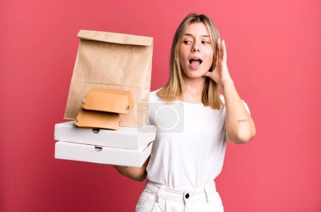 Photo for Young pretty woman feeling happy, excited and surprised. delivery and take away food concept - Royalty Free Image