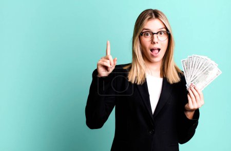 Photo for Young pretty woman feeling like a happy and excited genius after realizing an idea. business and money concept - Royalty Free Image