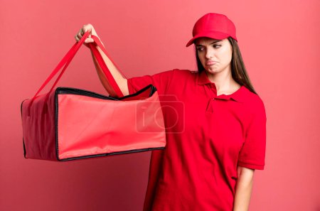 Photo for Young pretty woman feeling sad, upset or angry and looking to the side. pizza delivery concept - Royalty Free Image