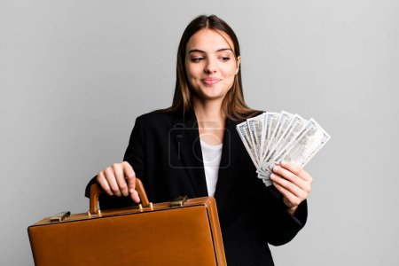 Photo for Young pretty businesswoman with a suitcase - Royalty Free Image