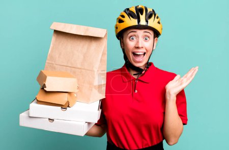 Photo for Feeling happy and astonished at something unbelievable. fast food delivery or take away - Royalty Free Image