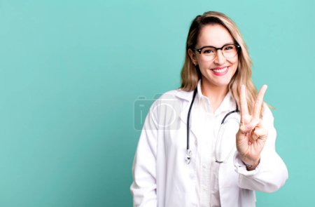 Photo for Smiling and looking happy, gesturing victory or peace. medicine student or physician - Royalty Free Image