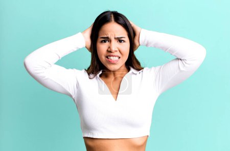 Photo for Hispanic pretty woman feeling stressed, worried, anxious or scared, with hands on head, panicking at mistake - Royalty Free Image