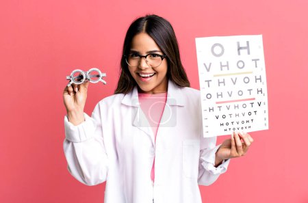 Foto de Hispanic pretty young adult woman. optical vision test concept - Imagen libre de derechos