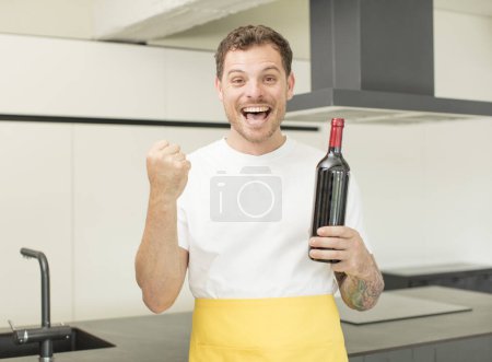 Photo for Feeling shocked,laughing and celebrating success. bottle of wine concept - Royalty Free Image