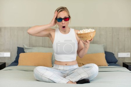 Photo for Feeling extremely shocked and surprised. film and popcorns concept - Royalty Free Image