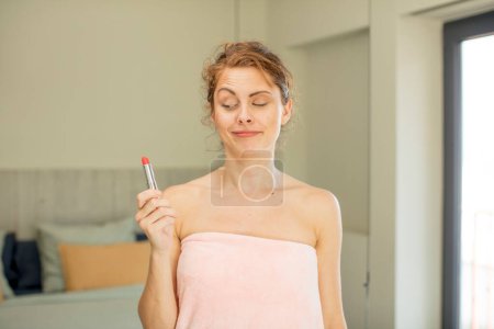 Photo for Young pretty woman smiling and looking with a happy confident expression. lipstick concept - Royalty Free Image