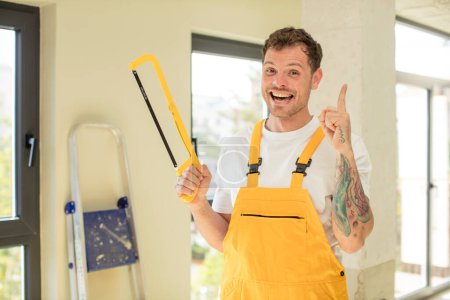 Photo for Feeling like a happy and excited genius after realizing an idea. handyman saw concept - Royalty Free Image