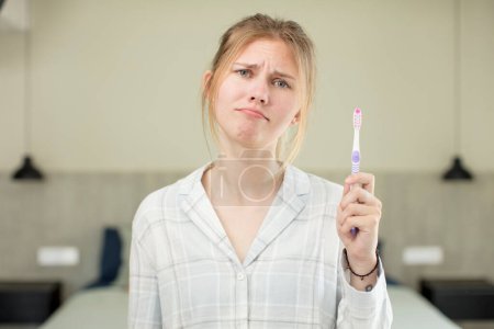 Photo for Young pretty woman feeling sad and whiney with an unhappy look and crying. toothwash concept - Royalty Free Image