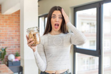 Photo for Pretty young model looking happy, astonished and surprised. homemade cookies concept - Royalty Free Image