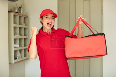 Photo for Pretty woman feeling shocked,laughing and celebrating success. pizza delivery concept - Royalty Free Image