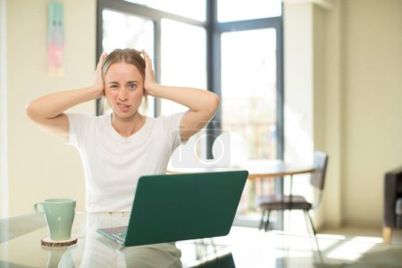 Photo for Caucasian pretty woman with a laptop feeling frustrated and annoyed, sick and tired of failure, fed-up with dull, boring tasks - Royalty Free Image
