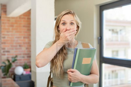 Photo for Covering mouth with a hand and shocked or surprised expression. university student concept - Royalty Free Image