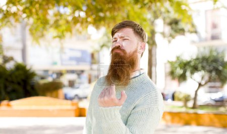 Photo for Red hair bearded man feeling happy, successful and confident, facing a challenge and saying bring it on! or welcoming you - Royalty Free Image