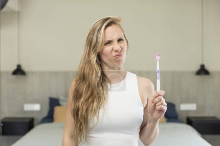 Photo for Feeling sad and whiney with an unhappy look and crying. toothbrush concept - Royalty Free Image