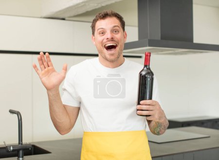 Photo for Feeling happy and astonished at something unbelievable. bottle of wine concept - Royalty Free Image