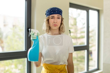 Photo for Pretty woman feeling sad and whiney with an unhappy look and crying. housekeeper concept - Royalty Free Image