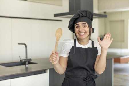 Photo for Young woman feeling happy and astonished at something unbelievable. chef concept - Royalty Free Image