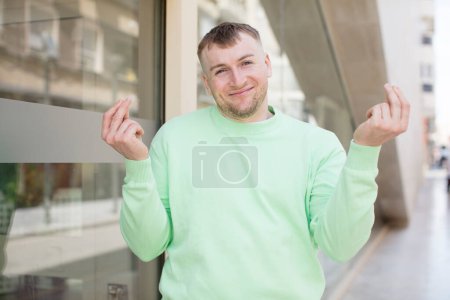 Photo for Handsome man feeling happy, positive and successful, money concept and celebrating good results - Royalty Free Image