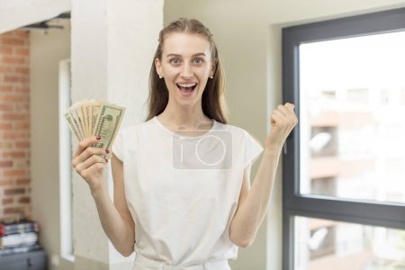 Photo for Feeling shocked,laughing and celebrating success. dollar banknotes concept - Royalty Free Image