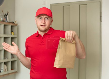 Photo for Shrugging, feeling confused and uncertain. delivery paper bag concept - Royalty Free Image