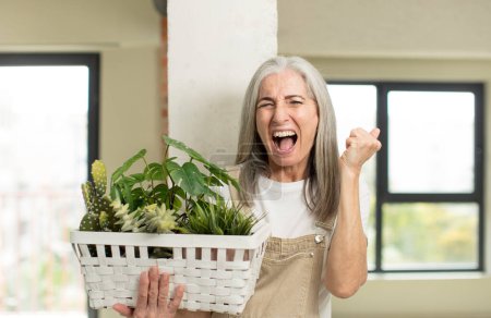Photo for Pretty senior woman looking angry, annoyed and frustrated. gardener concept - Royalty Free Image