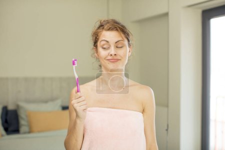 Photo for Young pretty woman smiling and looking with a happy confident expression.  mouthwash concept - Royalty Free Image