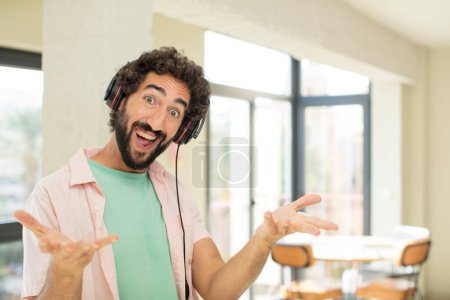 Photo for Young crazy man listening music with headphones - Royalty Free Image