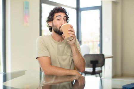 Photo for Young man with a coffee cup - Royalty Free Image