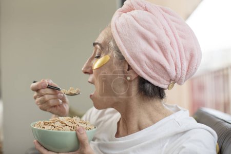 Photo for Adult woman with a facial mask - Royalty Free Image