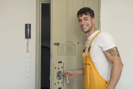Photo for Young man locksmith concept - Royalty Free Image