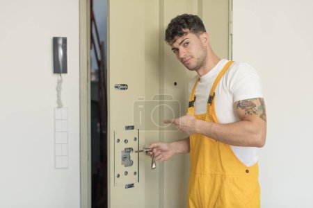Photo for Young man locksmith concept - Royalty Free Image