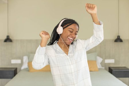 Photo for Young pretty woman with headphones listening music - Royalty Free Image