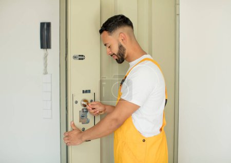 Photo for Young arab man locksmith concept - Royalty Free Image