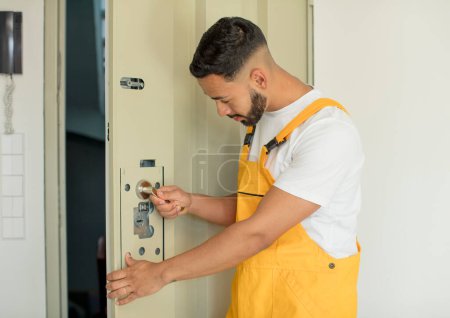Photo for Young arab man locksmith concept - Royalty Free Image