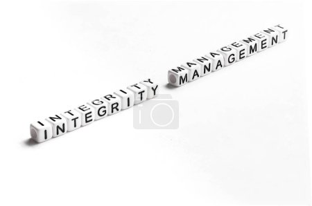 Photo for Text integrity management made out of white plastic cubes emphasizing how to apply the highest ethical standards in everyday life and business relations - Royalty Free Image