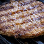 Grilled burger on the barbecue grate
