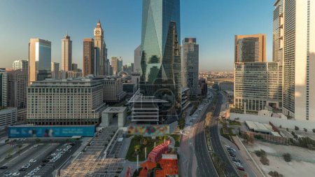 Photo for Panorama showing Dubai International Financial district aerial timelapse. View of business and financial office towers. Skyscrapers with hotels and shopping malls near downtown - Royalty Free Image