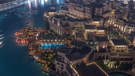 Photo for Aerial view to Old Town Island from above night  with swimming pool. Dubai downtown with fountains area near mall and souk - Royalty Free Image