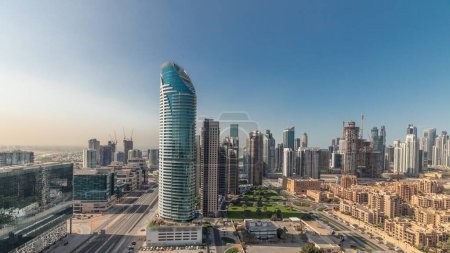 Téléchargez les photos : Panorama showing Dubai's business bay and downtown towers aerial morning . Rooftop view of some skyscrapers and new buildings under construction with thaditional houses of old town district - en image libre de droit