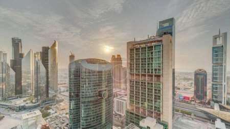 Foto de Sunset over Dubai international financial center skyscrapers aerial . Panoramic view with cloudy sky - Imagen libre de derechos