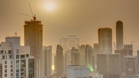 Téléchargez les photos : Aerial sunrise over big futuristic city . Business bay and Downtown district with skyscrapers, Dubai, United Arab Emirates skyline. - en image libre de droit