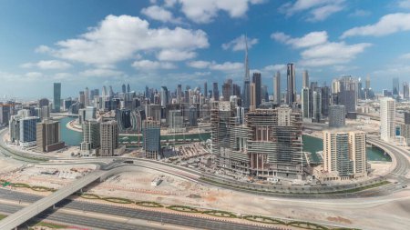 Photo for Panorama showing skyline of Dubai downtown district with business bay . Aerial view of many modern skyscrapers with cloudy blue sky. United Arab Emirates. - Royalty Free Image
