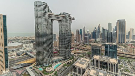 Photo for Pnorama showing futuristic Dubai Downtown and finansial district skyline aerial . Many towers and skyscrapers with traffic on streets. City walk district on a background - Royalty Free Image