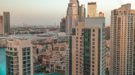 Photo for Aerial skyline of buildings in Downtown Dubai  during sunset. Shopping mall and traditional houses of old town. Skyscrapers in Deira district on a background - Royalty Free Image